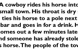 A cowboy rides his horse into a small town