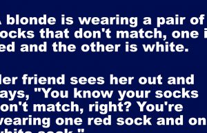 A blonde is wearing a pair of socks that don’t match