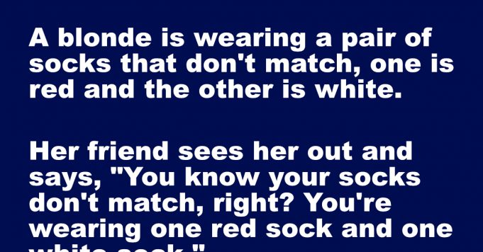 A blonde is wearing a pair of socks that don’t match