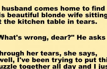 A Blonde Is Putting Together A Puzzle