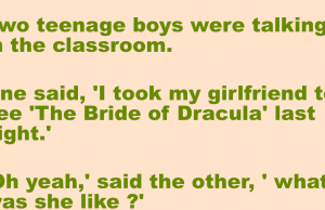 Two teenage boys were talking in the classroom.