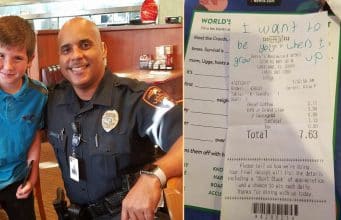 9-year-old boy gives unknown police officer a note in a restaurant