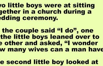 Two little boys were at sitting together in a church